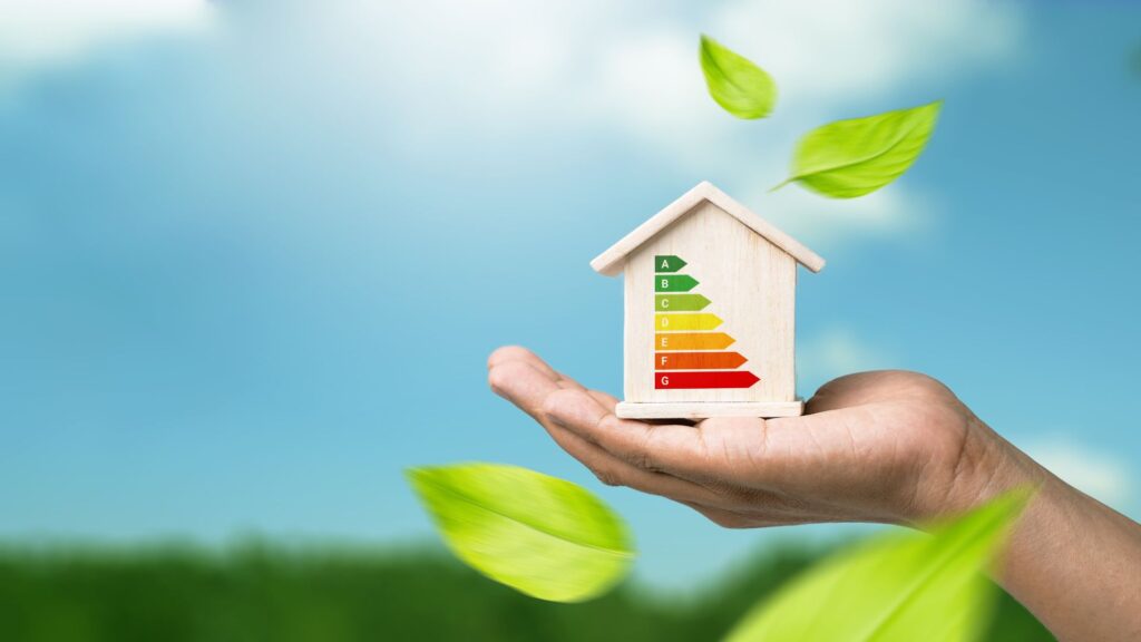 Image promoting EPCs and property value, showing a person holding a model house with energy efficiency icons, and text noting properties with A-B EPC ratings sell for 5-10% more than lower-rated homes, boosting market appeal. - EPC a Legal Requirement