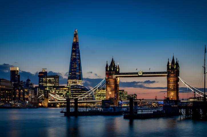London skyline at night with Tower Bridge and The Shard – guide for overseas landlords